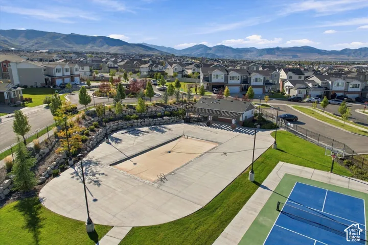 Community amenities featuring a tennis court, basketball court, pool, and a clubhouse with covered patio