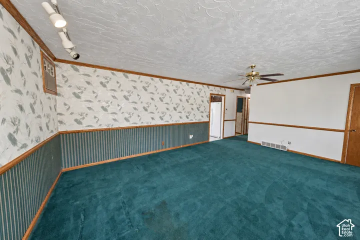 Spacious interior with wall-to-wall carpeting and wainscoting