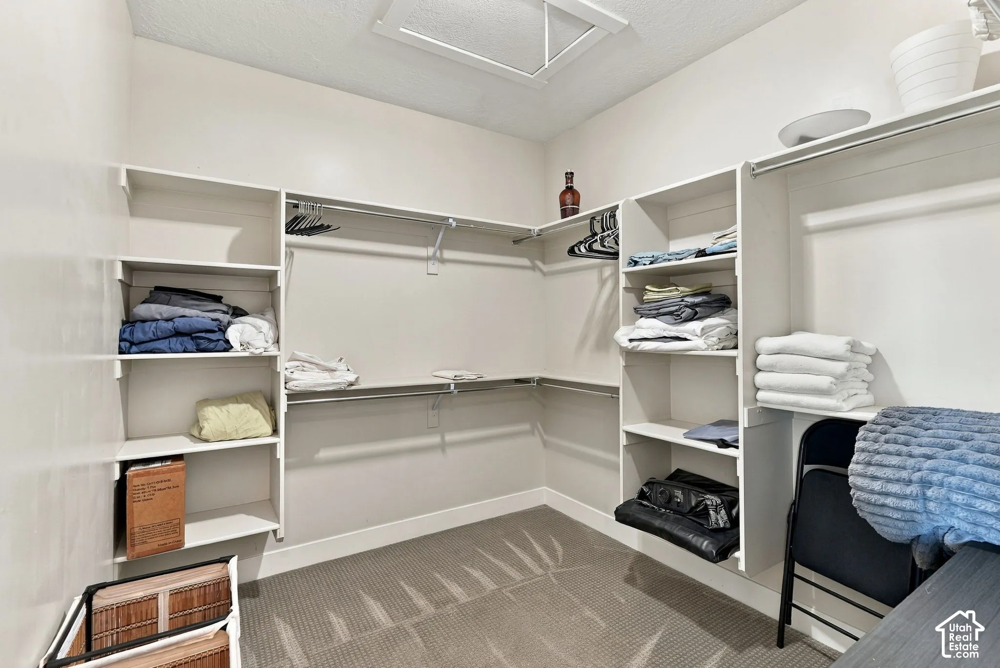 Built-in closet system with multiple shelving units and clothing rods