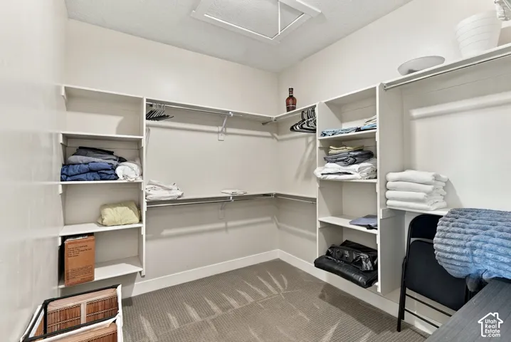 Built-in closet system with multiple shelving units and clothing rods