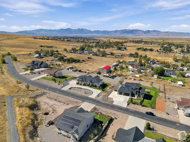 Expansive mountain range backdrop and rural setting