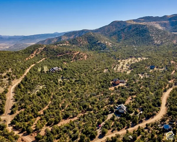 Expansive mountainous terrain with abundant natural tree coverage