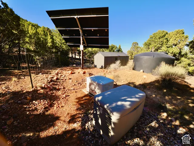 Solar panel array, storage shed, and large water tank