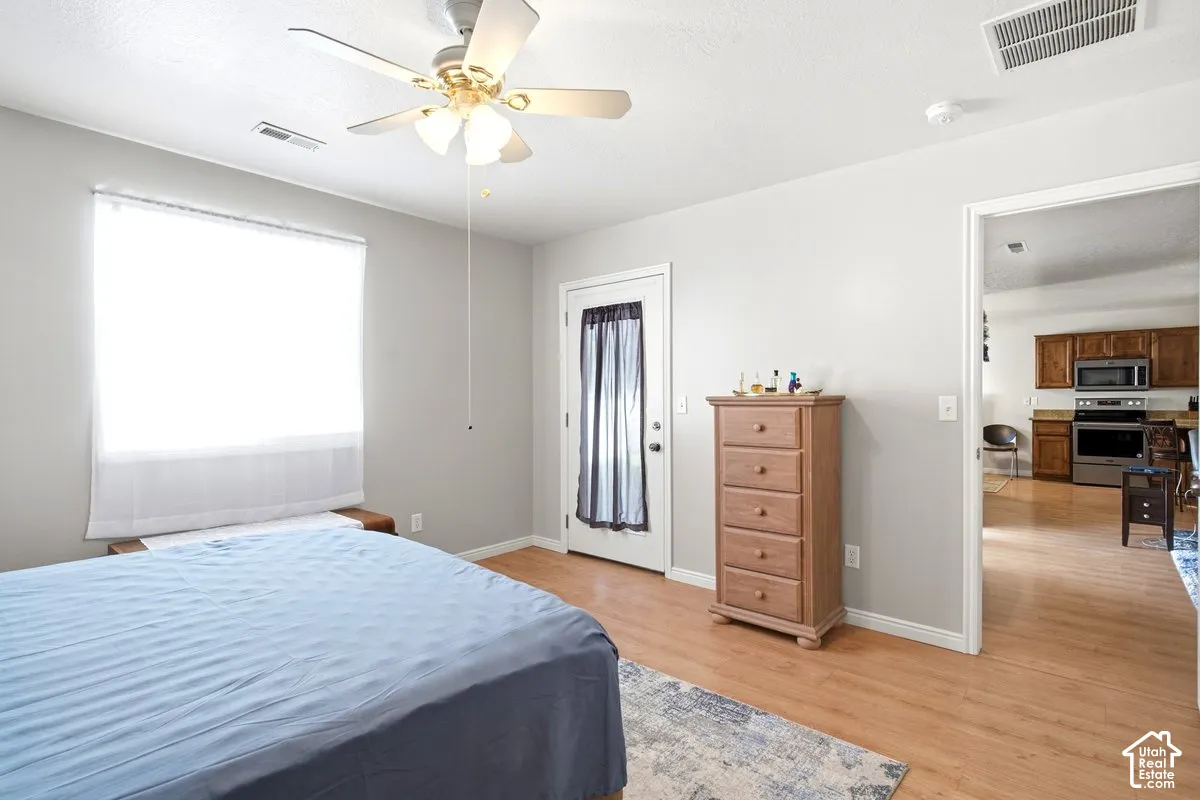 Wood-finish flooring with light gray wall paint