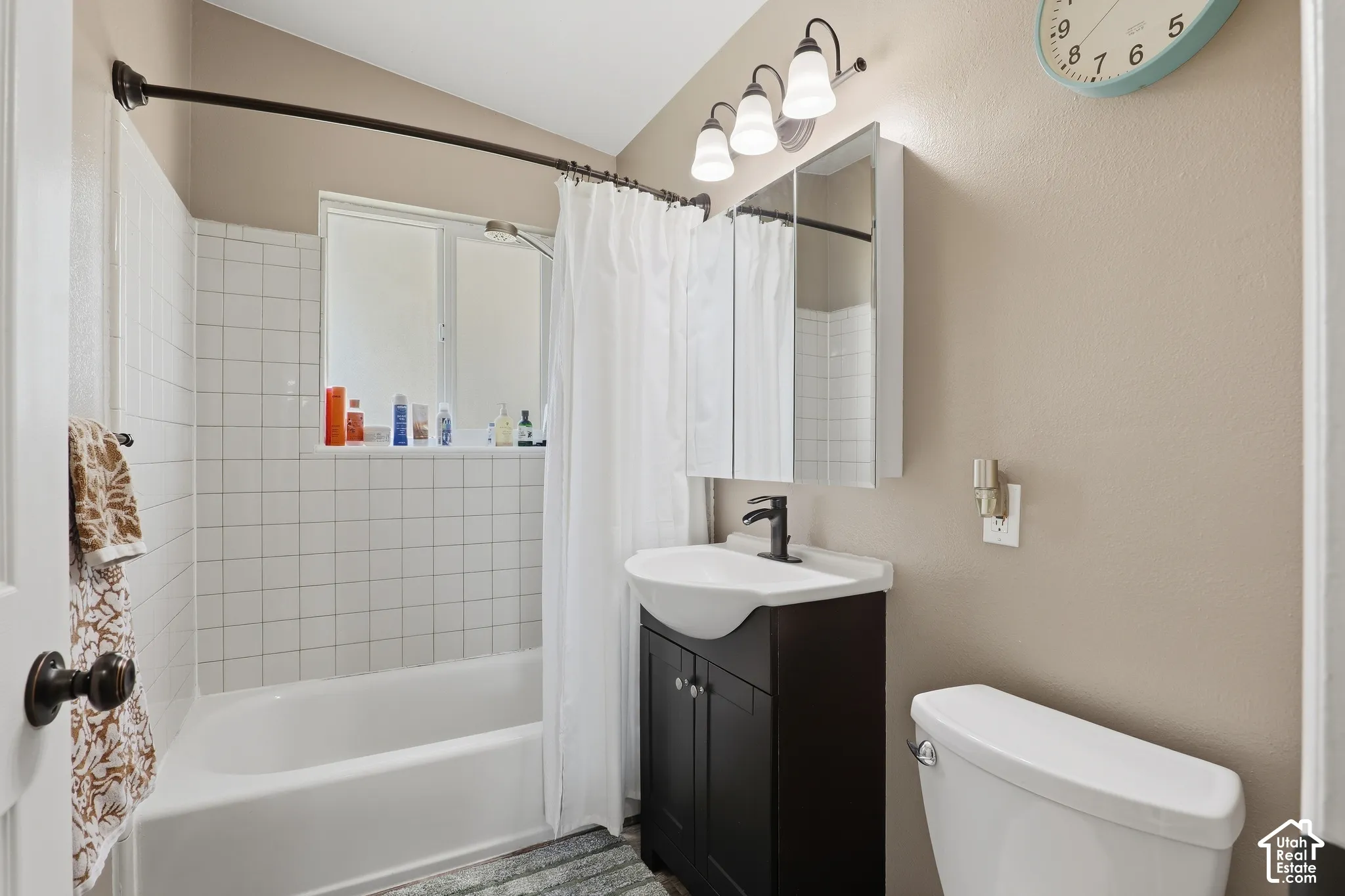 White subway tile shower surround with integrated window