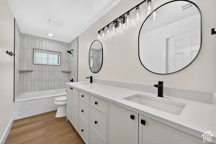 Dual basin vanity with white countertops