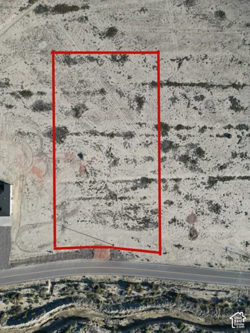 Aerial perspective showcasing a large, undeveloped parcel of land