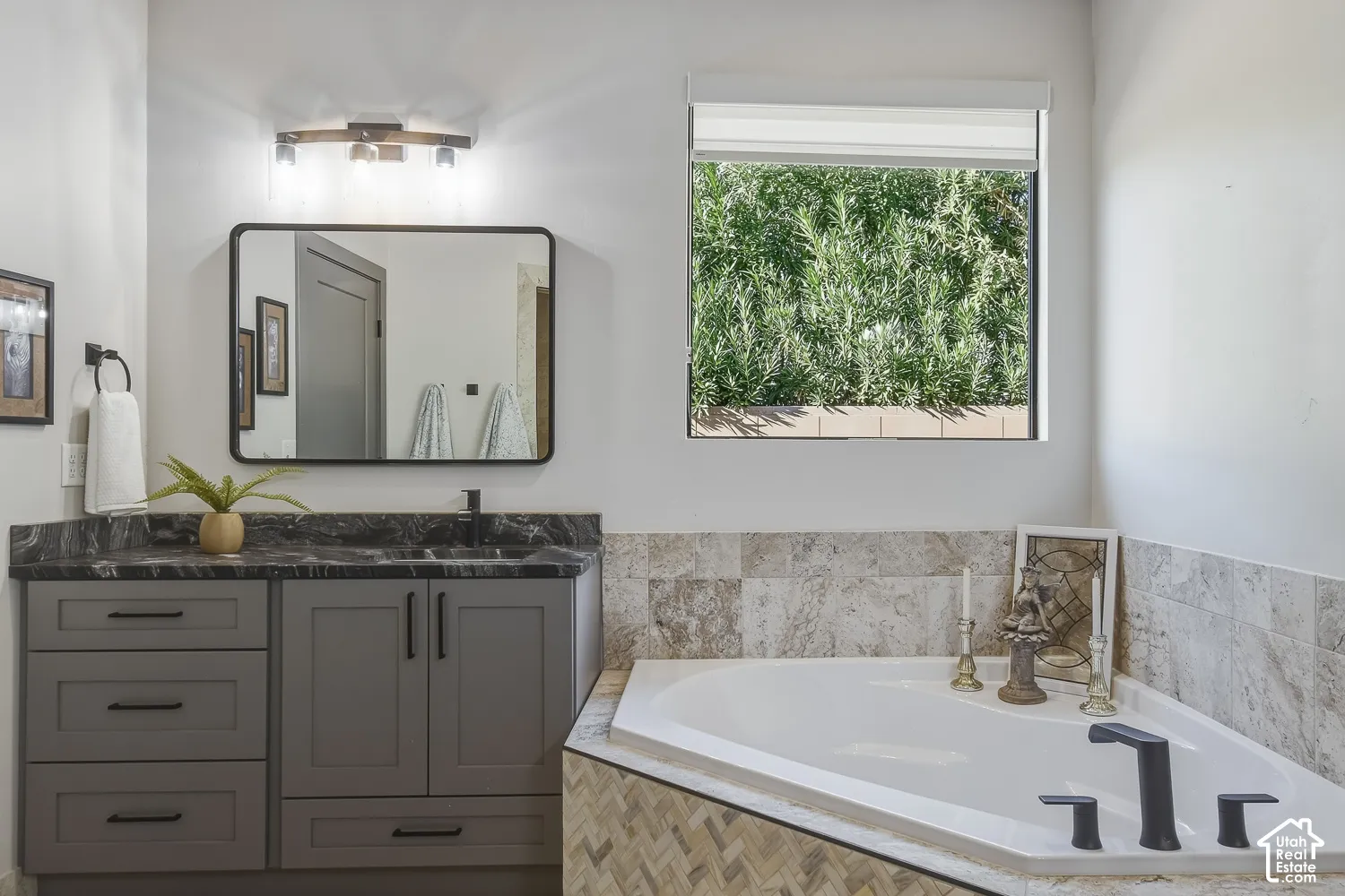 Primary ensuite with double vanity and separate tub and shower