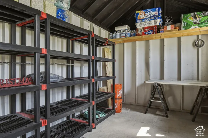 Inside the storage shed/workshop that is wired with electricity