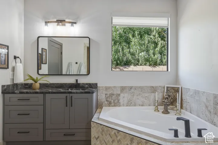 Primary ensuite with double vanity and separate tub and shower