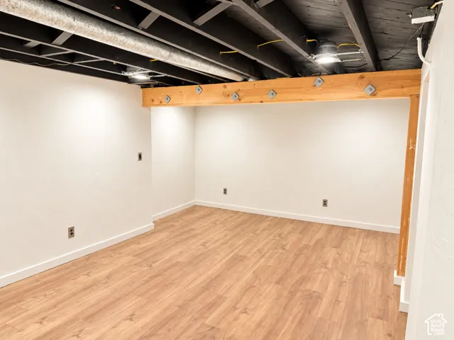 Recessed ceiling lighting, laminate flooring, exposed wooden beams, exposed ceiling joists