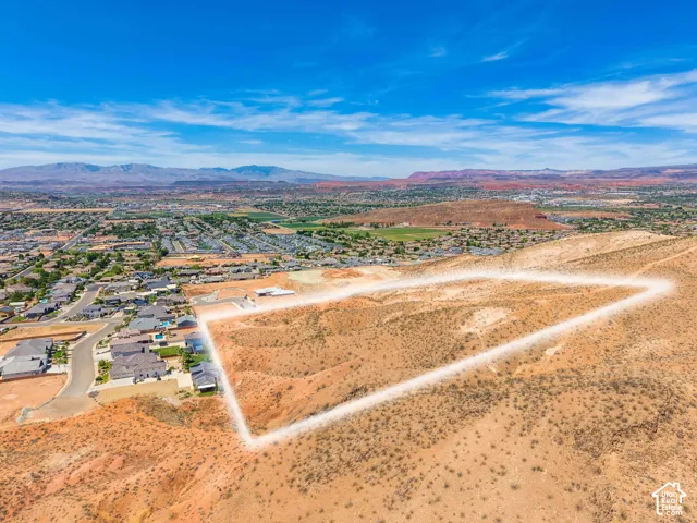 Expansive desert landscape with a defined property boundary