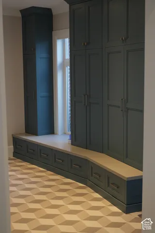 Built-in cabinetry with paneled doors and storage drawers