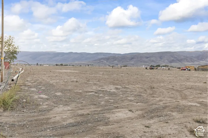 Expansive undeveloped land with a distant mountain backdrop