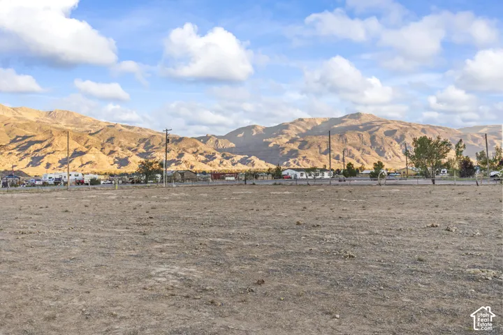 Expansive undeveloped lot with a mountainous backdrop