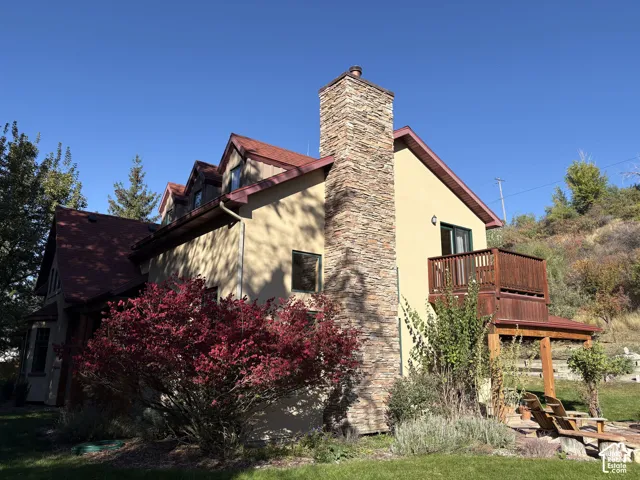 Stone-clad chimney extending above the roofline