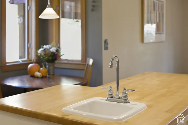 Integrated sink with chrome faucet set into a light wood countertop