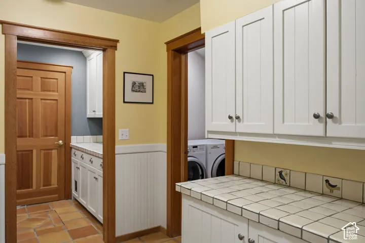 White shaker-style cabinetry with knob hardware