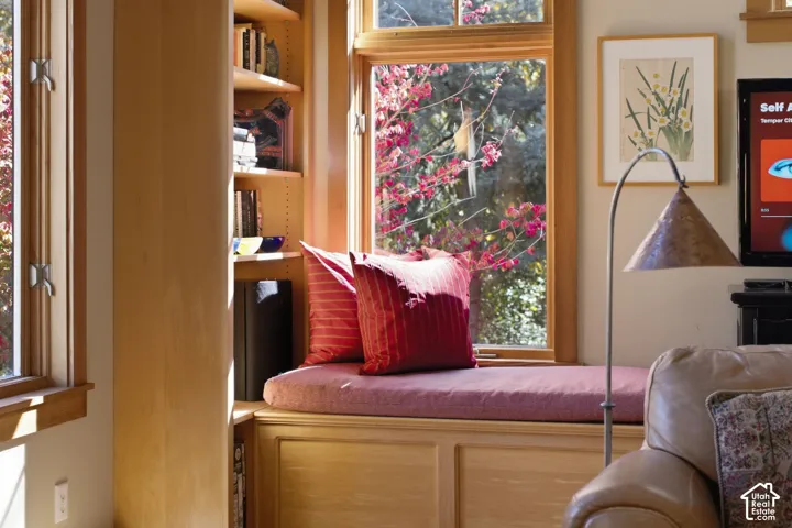 Built-in window seat with a cushioned surface and integrated storage