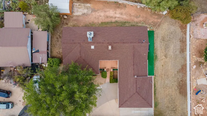 Brown shingle roof with a central air conditioning unit