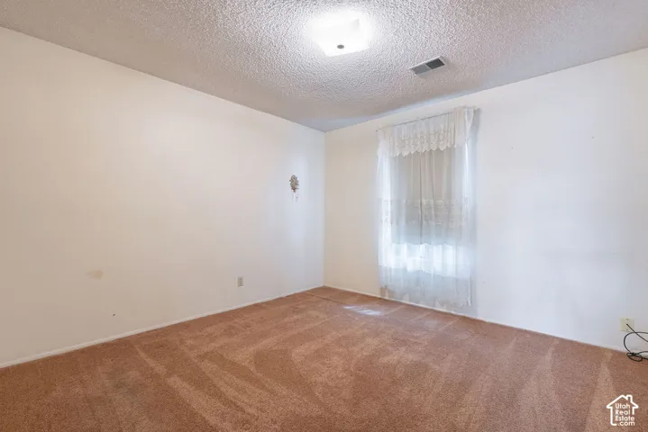 Wall-to-wall carpeting and neutral wall tones