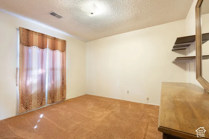 Neutral wall paint and ceiling lighting