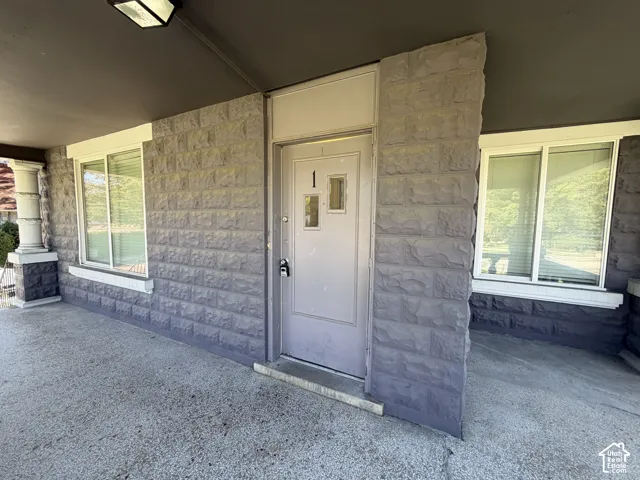 Covered entry with stone-look facade