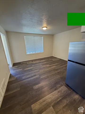 Wood-finish flooring, recessed lighting, and a window with blinds