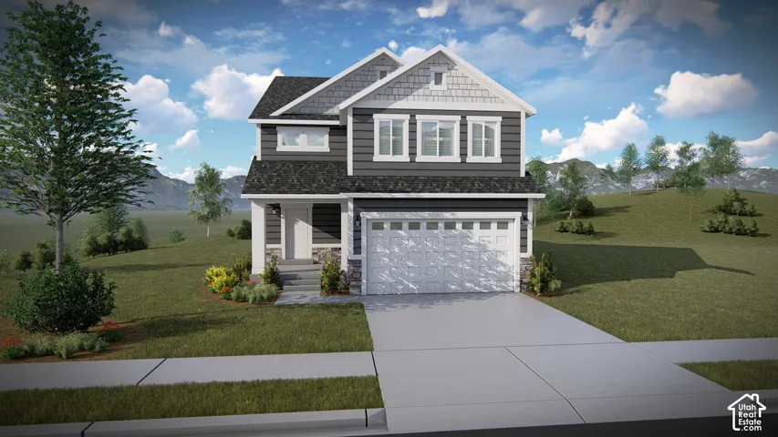 Two-story residence featuring a two-car garage, front landscaping, and a covered entry