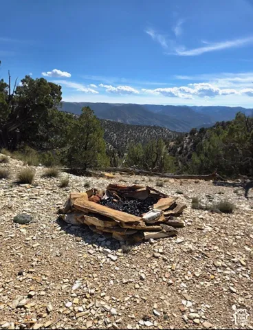 Stone fire pit with scenic mountain backdrop