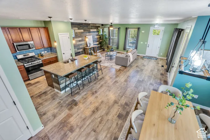 Open-concept living space with wood-finish flooring