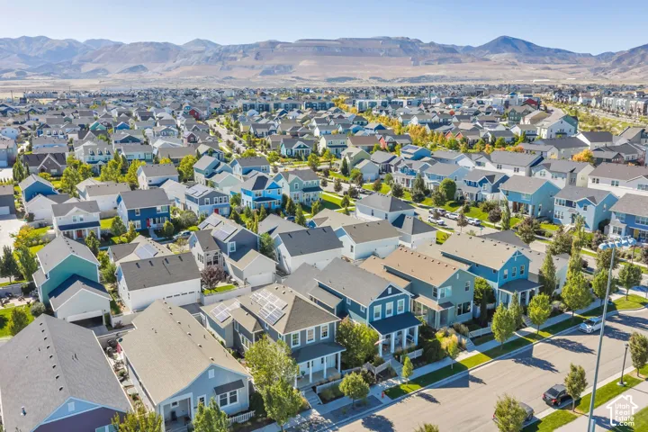 Residential neighborhood with diverse architectural styles, featuring paved streets and established landscaping
