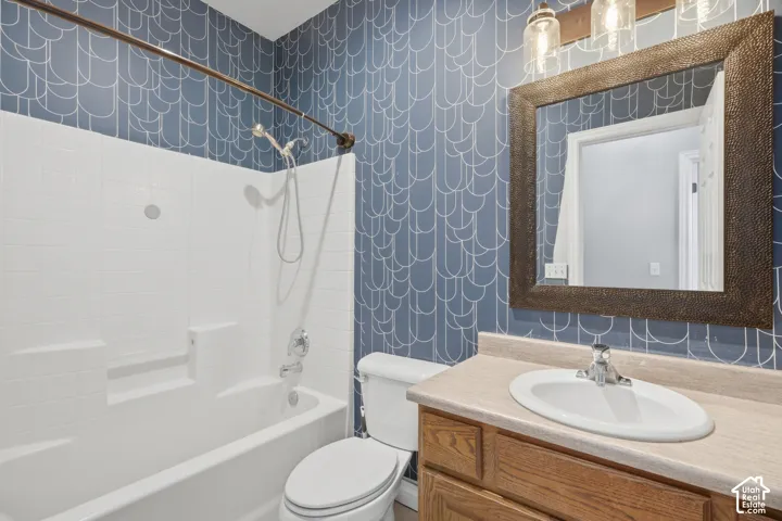 Tub and shower combination with white tile surround