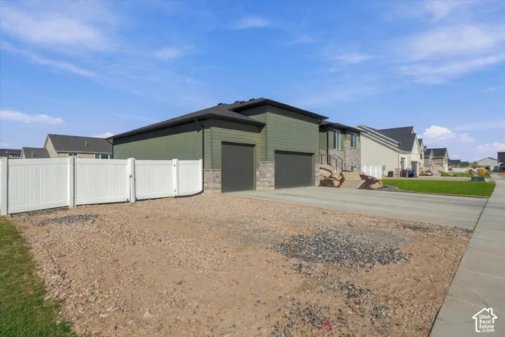 Two-car attached garage with stone veneer accents