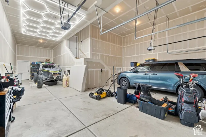 High ceilings, concrete flooring, and a unique hexagonal ceiling light fixture