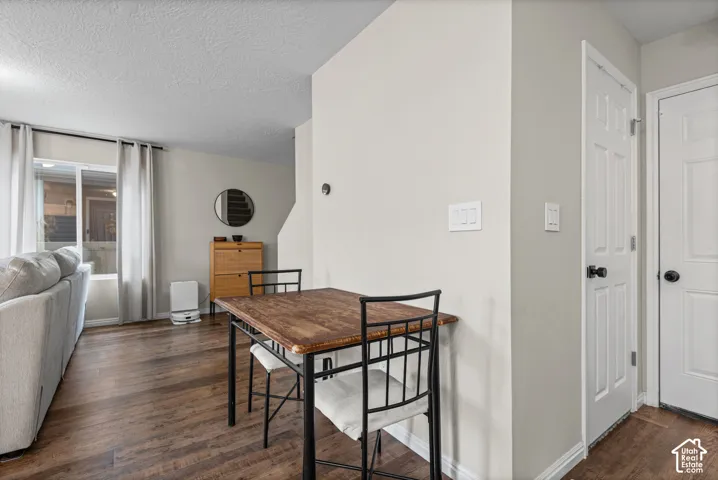 Wood-finish flooring throughout, light neutral wall tones, and white trim