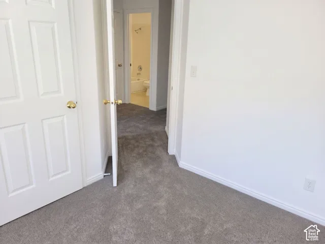 Wall-to-wall carpeting throughout, white interior doors with brass-finish hardware