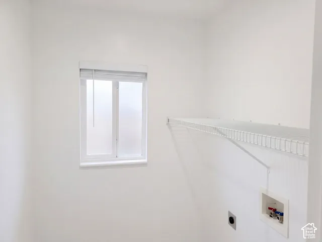 White painted walls with a frosted window and white blinds