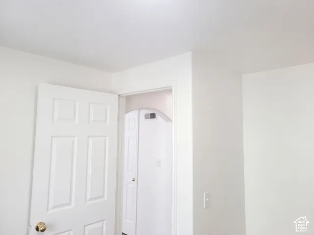 White paneled door with a brass knob