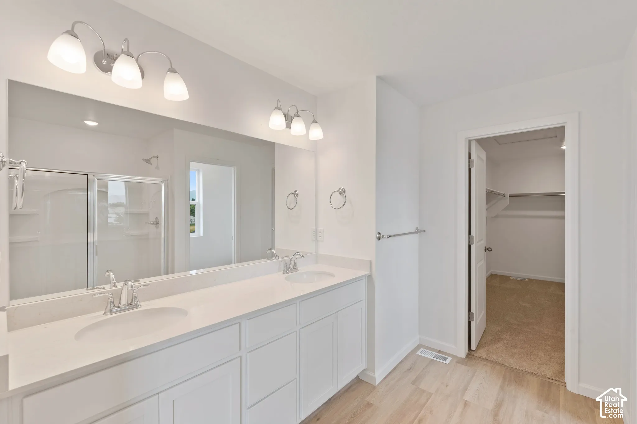 Primary Ensuite bath (Deluxe primary bath1). HOME TO BE BUILT! Pictures are of another similar Spec and not of this exact home. Colors and other options may vary from those seen here. Please see Sales consultant for details. Dual vanity shown with undermo