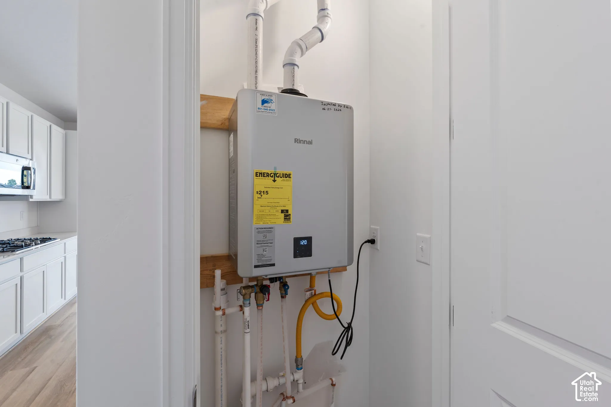 Tankless water heater with visible plumbing and electrical connections. HOME TO BE BUILT! Pictures are of another similar Spec and not of this exact home. Colors and other options may vary from those seen here. Please see Sales consultant for details.