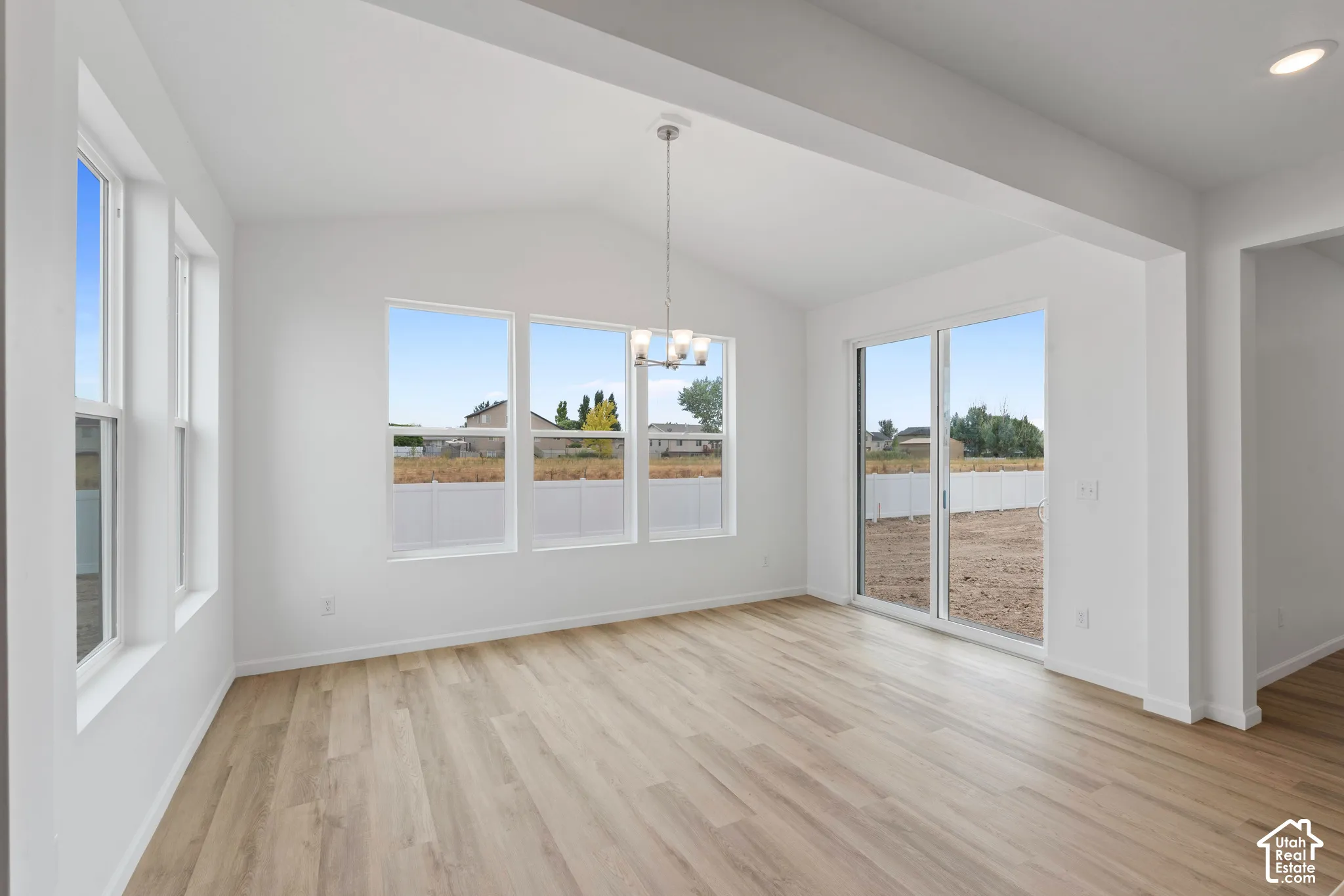 Vaulted ceiling, recessed lighting, wood-finish flooring, multiple windows, and a sliding glass door HOME TO BE BUILT! Pictures are of another similar Spec and not of this exact home. Colors and other options may vary from those seen here. Please see Sale