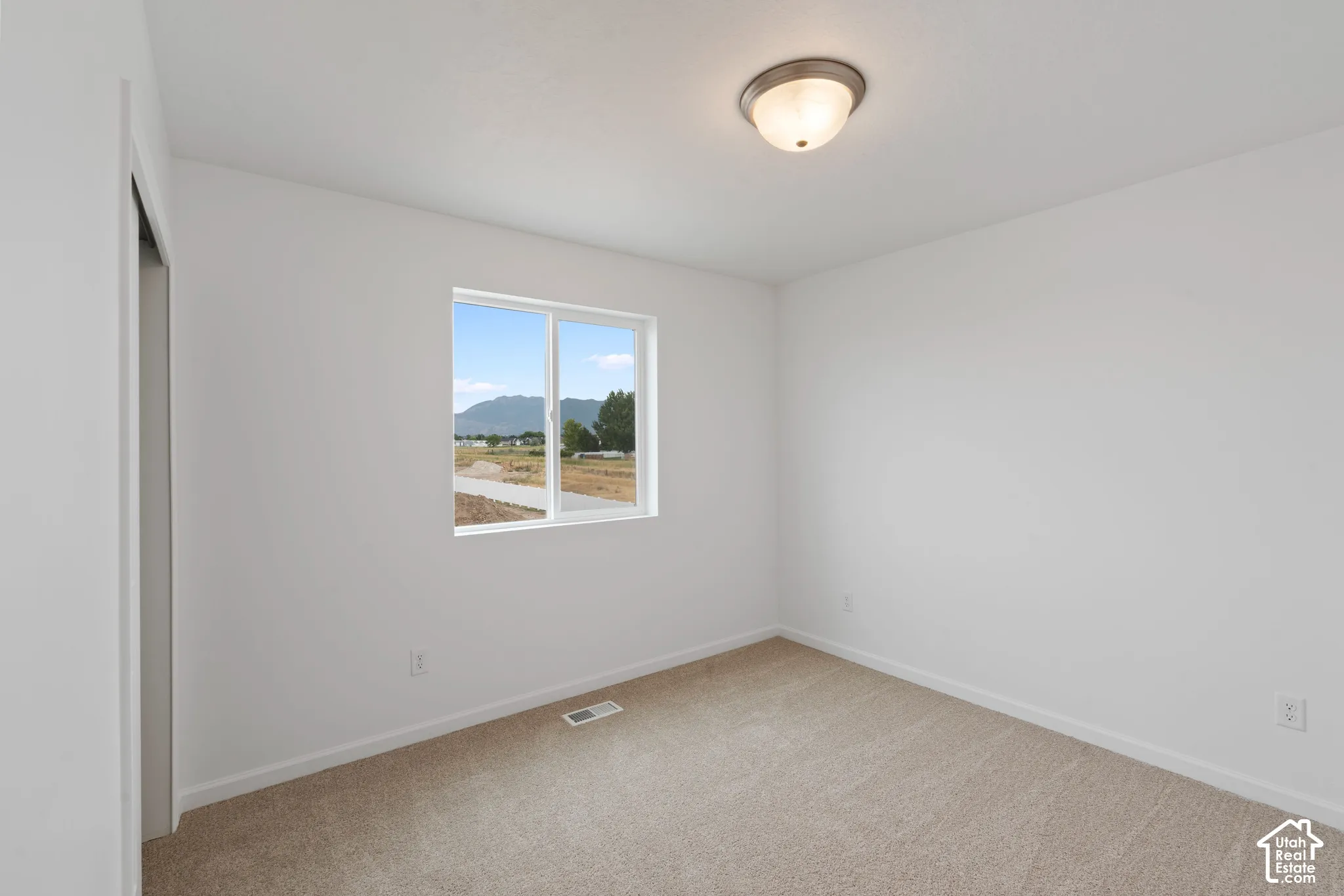 HOME TO BE BUILT! Pictures are of another similar Spec and not of this exact home. Colors and other options may vary from those seen here. Please see Sales consultant for details. Neutral carpeting, white wall finishes, and a flush-mount ceiling light