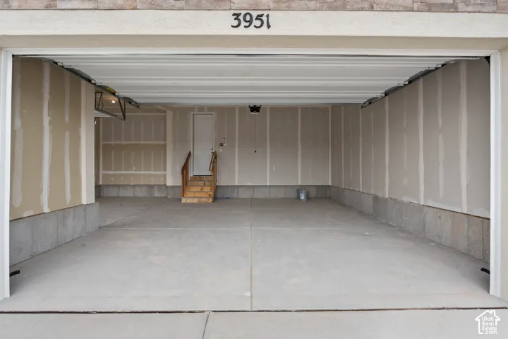 HOME TO BE BUILT! Pictures are of another similar Spec and not of this exact home. Colors and other options may vary from those seen here. Please see Sales consultant for details. Spacious garage with concrete flooring, unfinished drywall, and a built-in