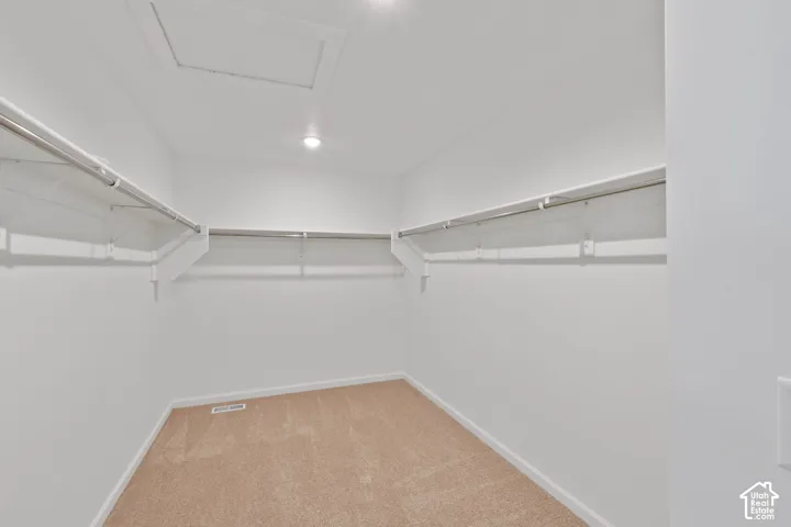 Primary walk in closet. HOME TO BE BUILT! Pictures are of another similar Spec and not of this exact home. Colors and other options may vary from those seen here. Please see Sales consultant for details.