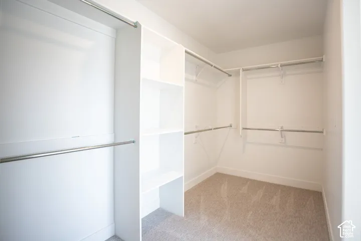 Spacious walk-in closet as part of primary suite.