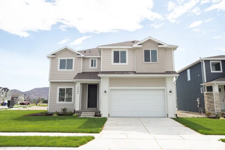 Redwood Elevation A with front and side yard landscaping installed on a .21 acre corner lot.