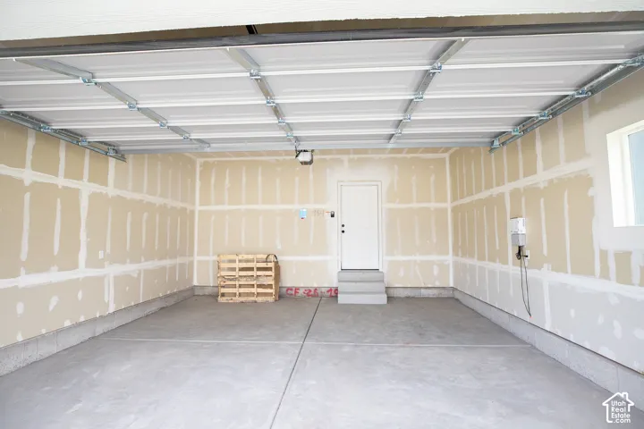 Two-car garage with taped finish.