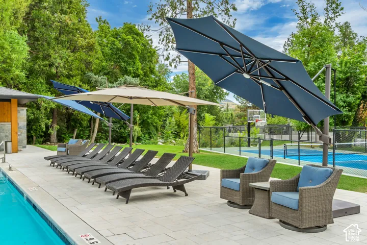 Paved pool deck with a rectangular swimming pool