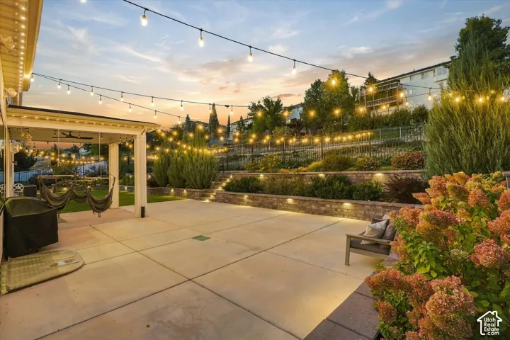 Expansive patio with string lighting and a covered area